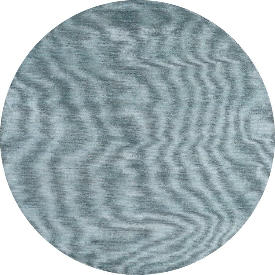 Runder Teppich mit strukturierter blauer Oberfläche und sichtbaren Gewebelinien.