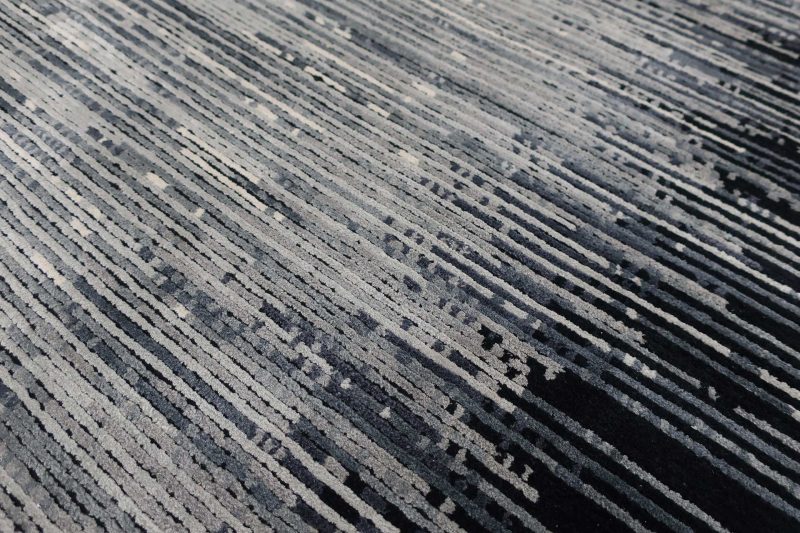 Nahaufnahme eines Teppichs mit gestreiftem Muster.